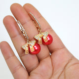 Golden Holiday Bow Red Drop Christmas Themed earrings, Red Gold Christmas Earrings Statement Christmas earrings.