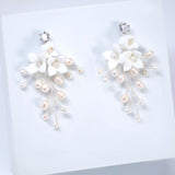 Ivory Serenade Bridal Earrings: White Ceramic Flower With Natural Pearl Leaves
