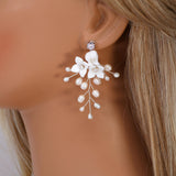 Ivory Serenade Bridal Earrings: White Ceramic Flower With Natural Pearl Leaves