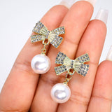 Golden Crystal Bow With white and Black Drop Earrings, Pearl Drop Earrings, Statement earrings.