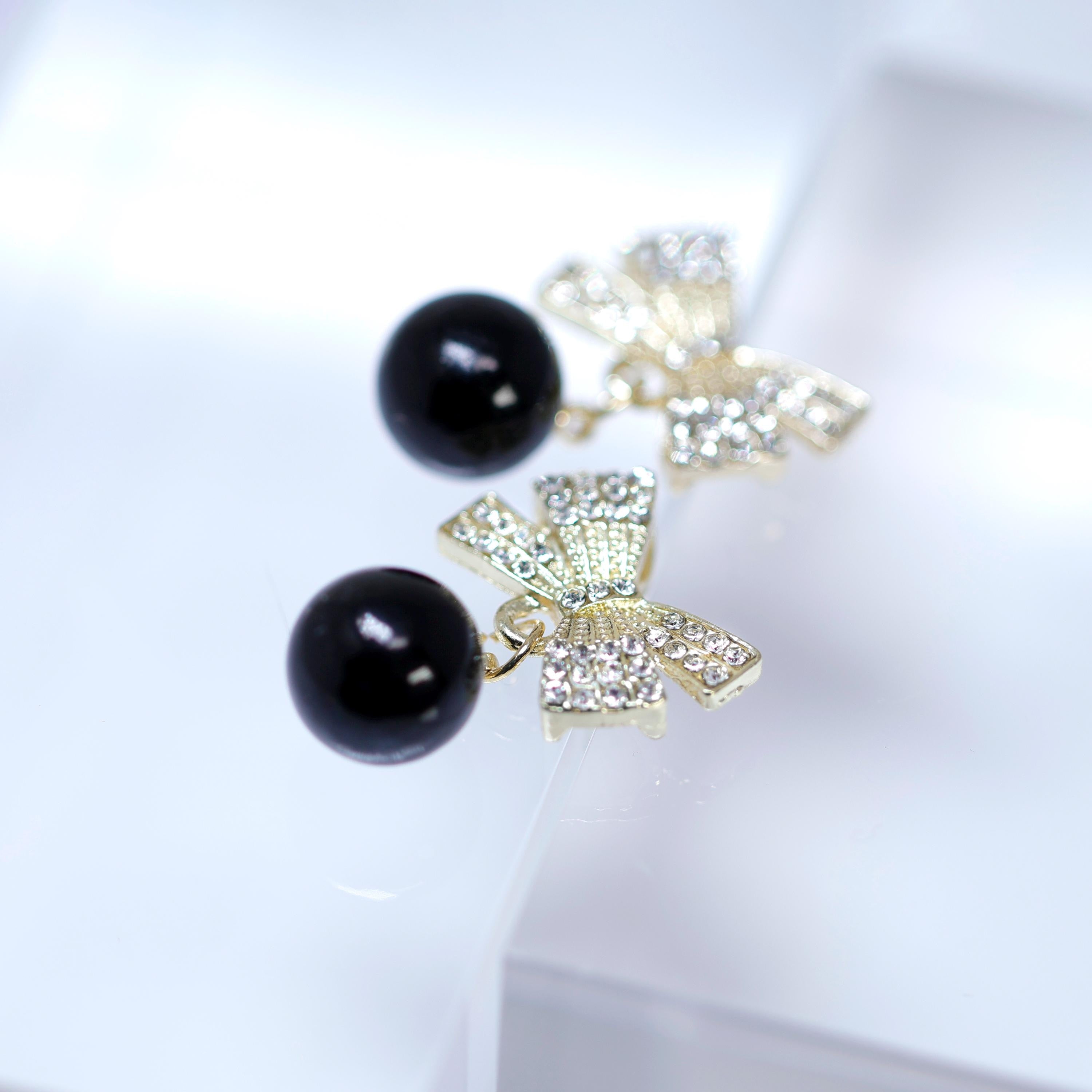 Golden Crystal Bow With white and Black Drop Earrings, Pearl Drop Earrings, Statement earrings.