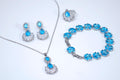 a collection of jewelry pieces, including earrings, a necklace, a ring, and a bracelet, all featuring blue gemstones.