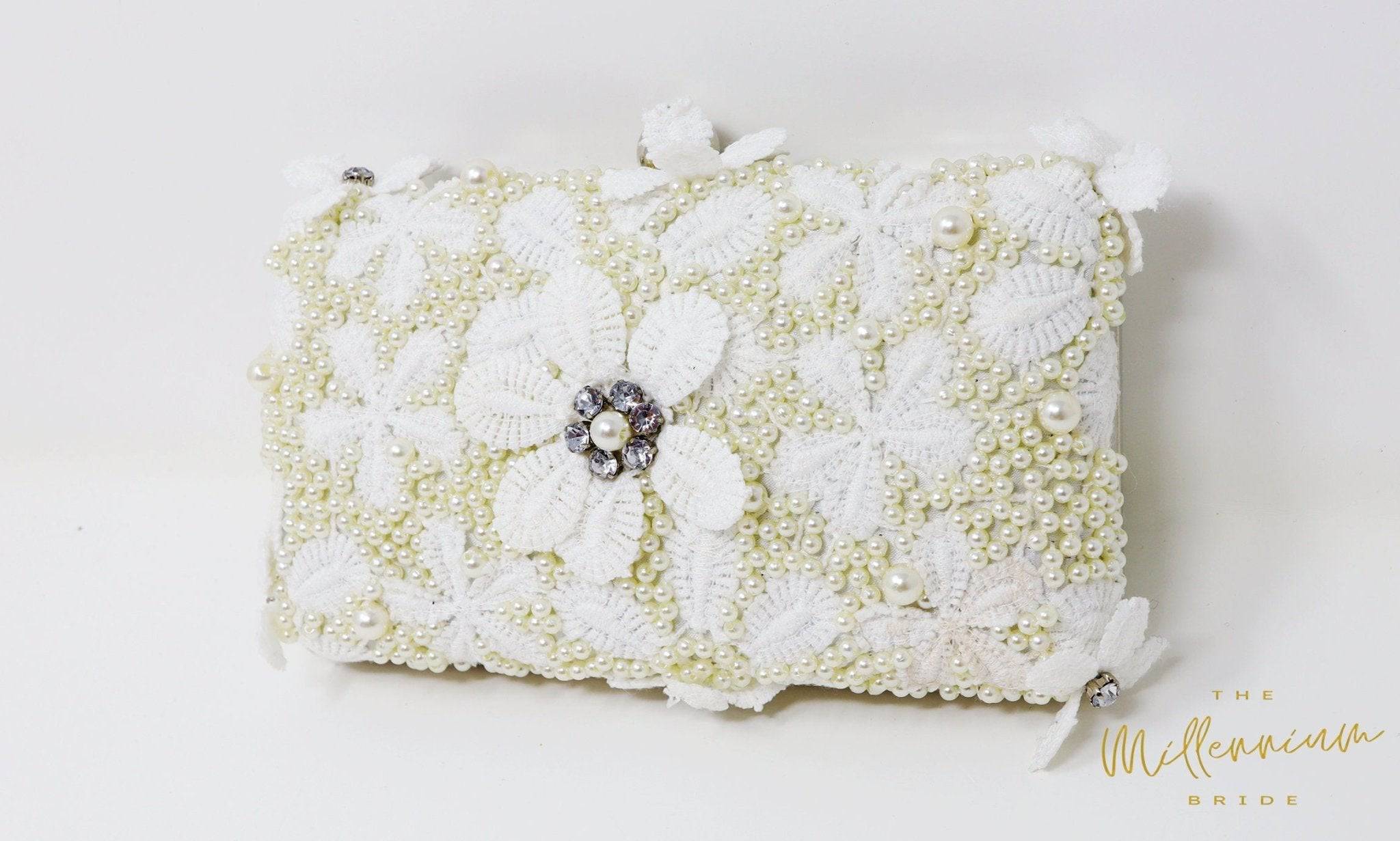 Modarta By Kamakshi White Clutch with Handcrafted Pearls Detailing An –  Nykaa Fashion